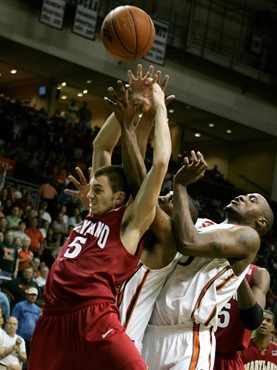 Maryland guard Eric Hayes fights for the ball with Anthony King in the second half. Miami won 78-63. (AP Photo/Lynne Sladky)