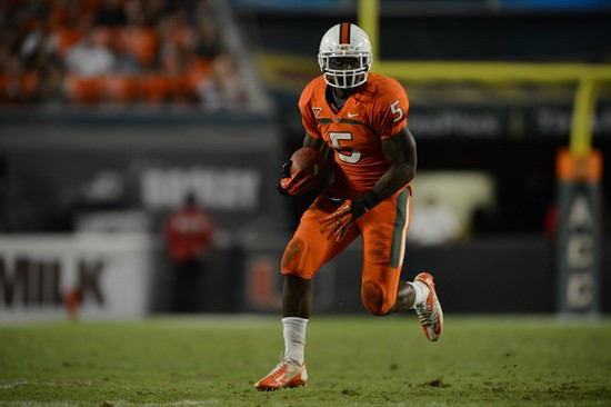 University of Miami Hurricanes running back Mike James #5 carries the ball against the Virginia Tech Hokies at Sun Life Stadium on November 1, 2012. ...