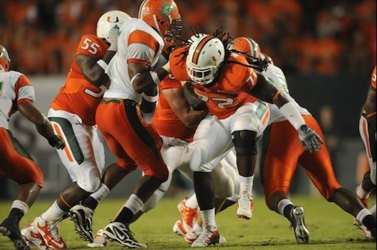 University of Miami Hurricanes offensive lineman Brandon Washington #72 blocks defenders in a game against the Florida A&amp;M Rattlers at Sun Life...