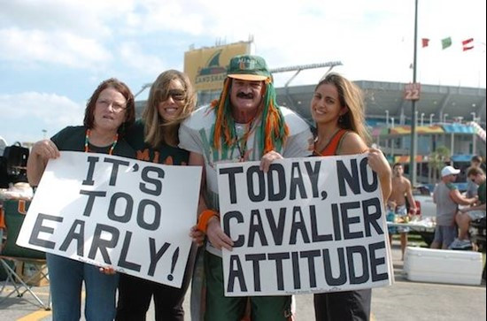 A University of Miami Hurricanes fan Richard Mulinary along with some friends show their team spirit in a game against the Virginia Cavaliers at Land...