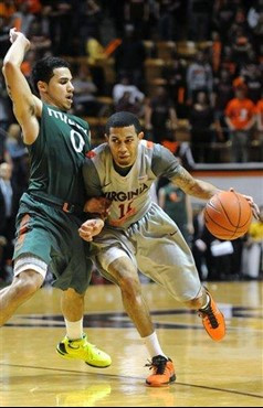 Virginia Tech's Erick Green drives against Miami's Shane Larkin during the second half of an NCAA college basketball game Wednesday, Jan. 30, 2013, at...