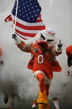 Sebastian the Ibis leads the University of Miami Hurricanes through a tunnel of smoke in a game against the Duke Blue Devils at Sun Life Stadium on...