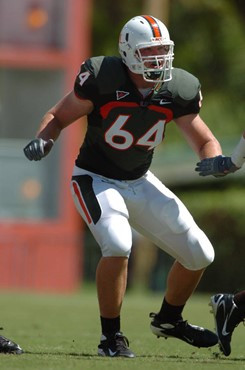 University of Miami offensive lineman Jason Fox #64 gets set to block in a game against the Duke University Blue Devils at the Orange Bowl on...