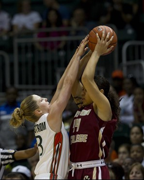 Miami's Stefanie Yderstrom (3) tries to block Boston College's Kat Cooper (44) from passing the ball during the half of an NCAA women's college...
