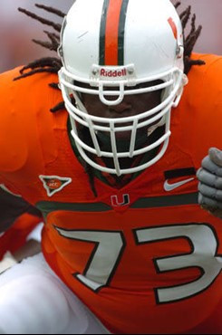 University of Miami Cyrim Wimbs #73,
Offensive Tackle gets set to block in a game against the Georgia Tech Yellow Jackets at the Orange Bowl on...
