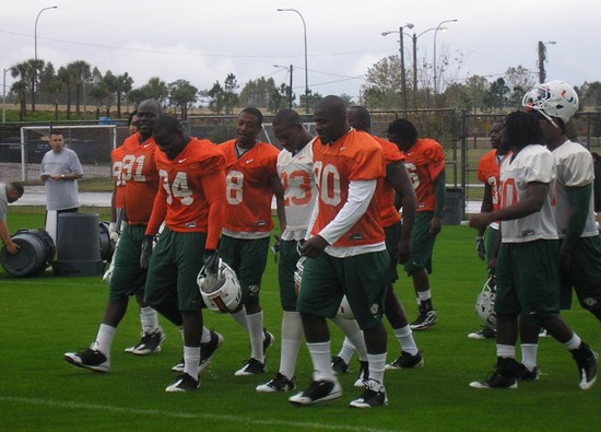 The Hurricanes take the field prior to practice Friday afternoon at Thunder Field at the Florida Citrus Bowl Sports Complex.