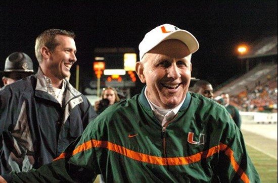 Univeristy of Miami head coach Larry Coker runs off the field after leading his team to a 17-14 upset over 18th ranked Boston College on November 23,...