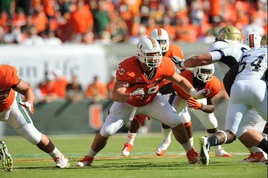 University of Miami Hurricanes offensive lineman Brandon Linder #65 gets set to block in a game against the Georgia Tech Yellow Jackets at Sun Life...