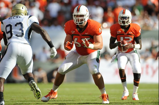 University of Miami Hurricanes offensive lineman Brandon Linder #65 gets set to block in a game against the Georgia Tech Yellow Jackets at Sun Life...