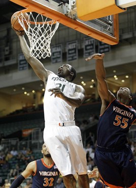 Miami's Dwayne Collins shoots over Virginia's Jerome Meyinsse (55) during an NCAA college basketball game on Tuesday, Feb. 23, 2010 in Coral Gables,...