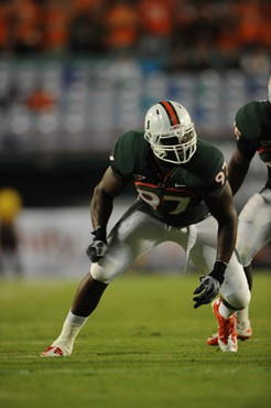 University of Miami Hurricanes defensive lineman Adewale Ojomo #97 plays in a game against the North Carolina Tar Heels at Sun Life Stadium on October...