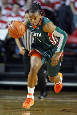 Miami's Riquna Williams (1) brings the ball down the court during the first half. (AP Photo/Karl B DeBlaker)