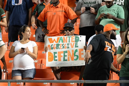 University of Miami Hurricane fans show their team spirit in a game against the Duke Blue Devils at Sun Life Stadium on September 27, 2014.  Photo by...