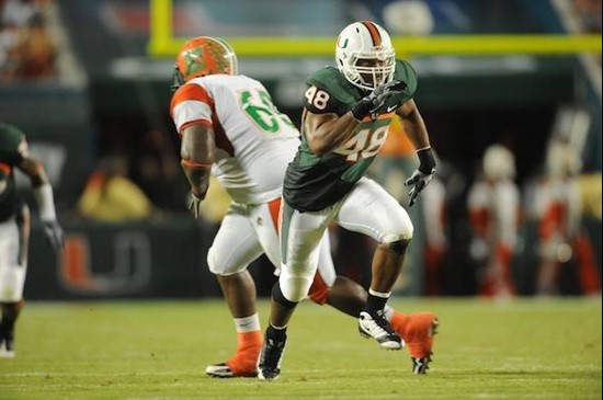 University of Miami Hurricanes defensive lineman Andrew Smith #48 plays in a game against the Florida A&M Rattlers at Land Shark Stadium on October...