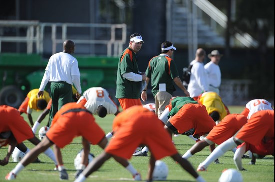 University of Miami Head Coach, Al Golden, instructs his team on how he wants them to execute his game plan during a spring practice at Greentree...