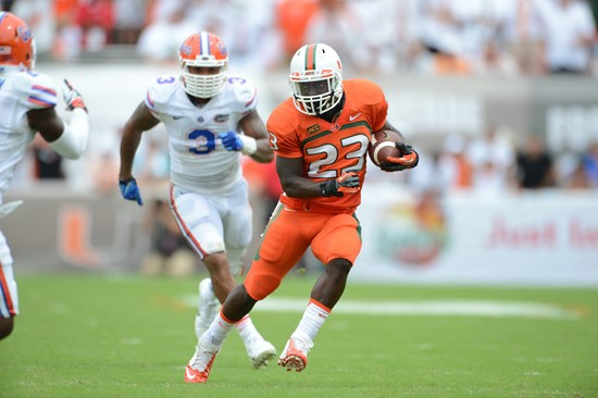 University of Miami Hurricanes running back Eduardo Clements #23 plays in a game against the #12 ranked University of Florida Gators at Sun Life...