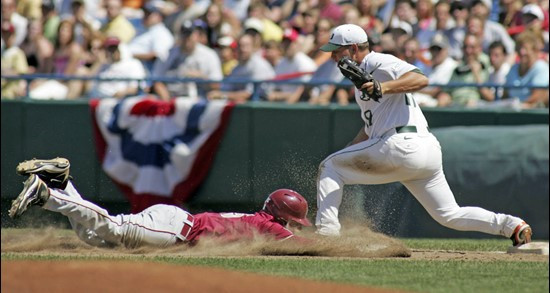 Tyler Holt is out at first base by Yonder Alonso, in the sixth inning.  Right fielder Dennis Raben caught a fly ball by Jason Stidham, and threw to...