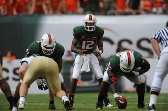 University of Miami Hurricanes quarterback Jacory Harris #12  gets set to take a snap from center Xavier Shannon #55 in a game against the Deamon...