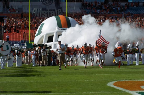 University of Miami Hurricanes head coach Al Golden leads his team on the field in a game against the Georgia Tech Yellow Jackets at Sun Life Stadium...