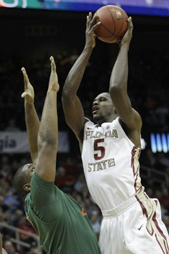 Florida State forward Bernard James (5) works against Miami center Reggie Johnson (42) during the first half of an NCAA college basketball game in the...