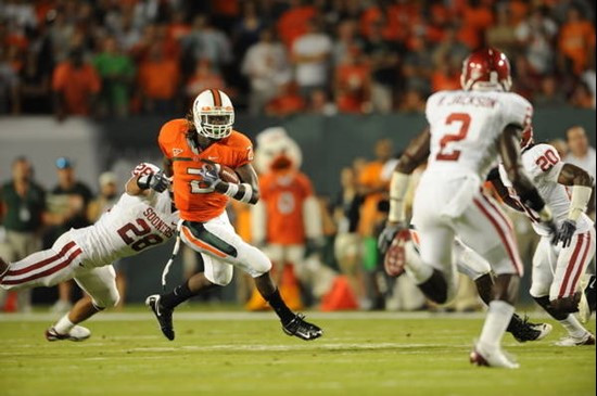 University of Miami Hurricanes running back Graig Cooper #2 breaks a tackle in a game against the Oklahoma Sooners at Land Shark Stadium on October 3,...