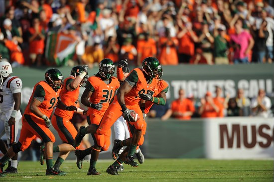 University of Miami Hurricanes defensive lineman Adewale Ojomo #97 plays in a game against the Virginia Tech Hokies at Sun Life Stadium on November...