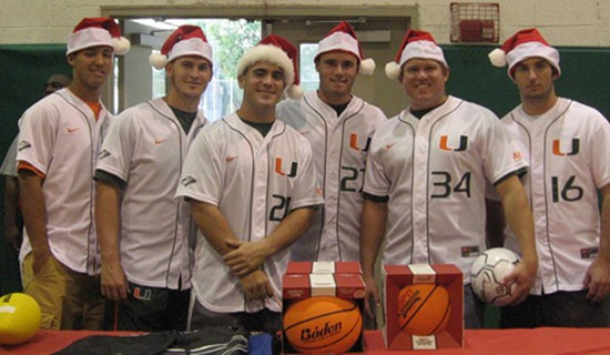 Members of the baseball team at the &acirc;?oeToy Fest&acirc;?? holiday celebration at the South Miami Rec Center in December.