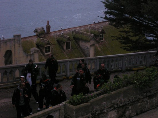 Players from both teams walking up to the top of the island.