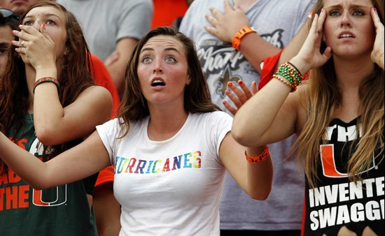 Miami fans react after Kansas State won 28-24 during an NCAA college football game Saturday, Sept. 24, 2011, in Miami. (AP Photo/The Miami Herald,...