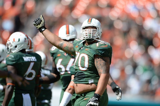 University of Miami Hurricanes offensive lineman Jonathan Feliciano #70 plays in a game against the North Carolina Tar Heels at Sun Life Stadium on...
