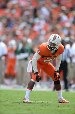 University of Miami Hurricanes offensive lineman Seantrel Henderson #77 gets set to block against the Wake Forest Demon Deacons at Sun Life Stadium on...
