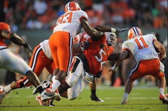 University of Miami Hurricanes defensive lineman Micanor Reqis #54 plays in a game against the Clemson Tigers at Land Shark Stadium on October 24,...