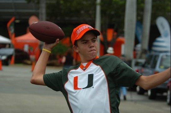 A University of Miami Hurricanes fan practice his quarterback skills in a game against the North Carolina Tar Heels at Dolphin Stadium on September...
