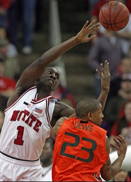 North Carolina State's J.J. Hickson (1) knocks the rebound away from Miami's James Dews (23) during the first half of a college basketball game in...