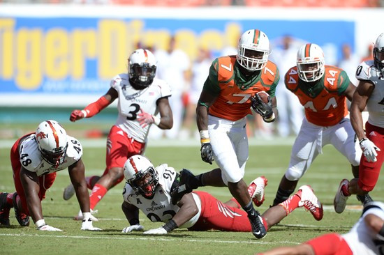 University of Miami Hurricanes running back Duke Johnson #8 plays in a game against the Cincinnati Bearcats at Sun Life Stadium on October 11, 2014.  ...