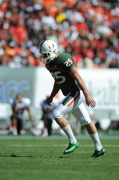 University of Miami Hurricanes kicker/punter Matt Bosher #25 kicks in a game against the Maryland Terrapins at Sun Life Stadium on November 6, 2010....