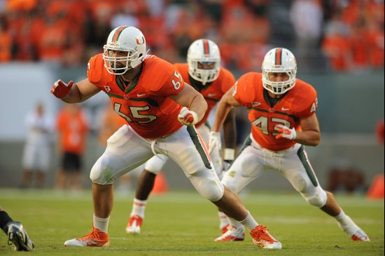 University of Miami Hurricanes offensive lineman Brandon Linder #65 gets set to block in a game against the Georgia Tech Yellow Jackets at Sun Life...