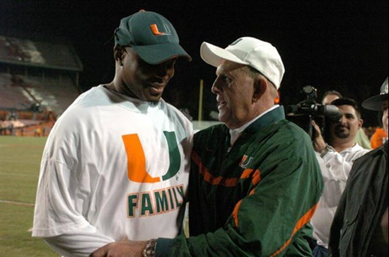 University of Miami head coach Larry Coker meets with former standout wide receiver Lamar Thomas after a 17-14 upset over 18th ranked Boston College...