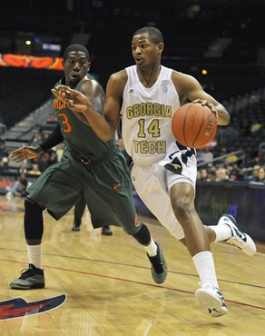 Georgia Tech guard Jason Morris drives against Miami guard Malcolm Grant. (AP Photo/Gregory Smith)