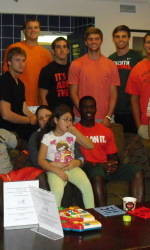 UM Football: Rushing into the Community
