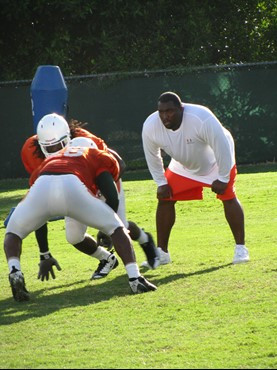 Clint Hurtt working with the defensive line at practice Tuesday morning at the Greentree Practice Fields.