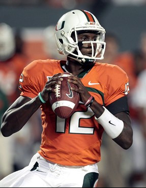 Miami quarterback Jacory Harris (12) prepares to pass against Virginia in the first half of an NCAA college football game in Miami, Thursday, Oct. 27,...