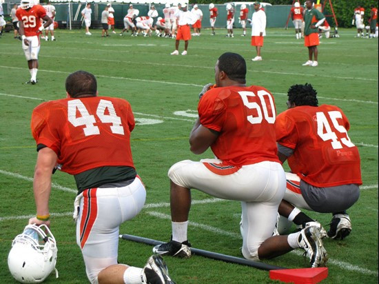 Colin McCarthy (44), Darryl Sharpton (50) and Ramon Buchanan (45) at practice Sunday morning at the Greentree Practice Fields.