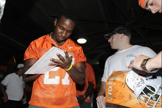 Lamar Miller signs an autograph for a fan at BankUnited CanesFest