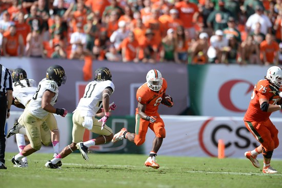 University of Miami Hurricanes running back Duke Johnson #8 carried the ball 30 times for 169 yards and scored two touchdowns in a game against the...