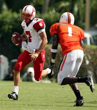 North Carolina State quarterback Daniel Evans (7) scrambles as Kenny Phillips gives chase during the second quarter. (AP Photo/Luis M. Alvarez)