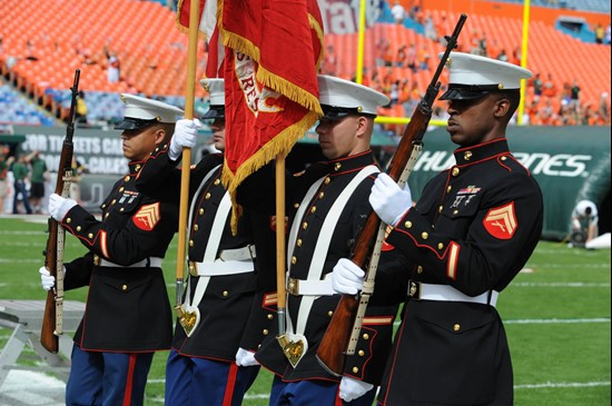 The United States Marine Corps color guard during the playing of "The Star-Spangled Banner" before a game between the University of Miami Hurricanes...