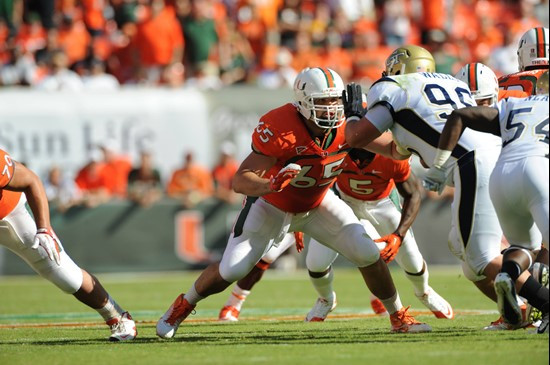 University of Miami Hurricanes offensive lineman Brandon Linder #65 gets set to block in a game against the Georgia Tech Yellow Jackets at Sun Life...
