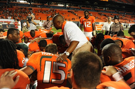 The University of Miami team joins for a prayer after defeating the Ohio State Buckeyes at Sun Life Stadium on September 17, 2011.  Photo by Steven...