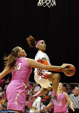Miami's Suriya McGuire, right, is defended by Florida State's Cierra Bravard, left, during the first half of an NCAA college basketball game Sunday,...